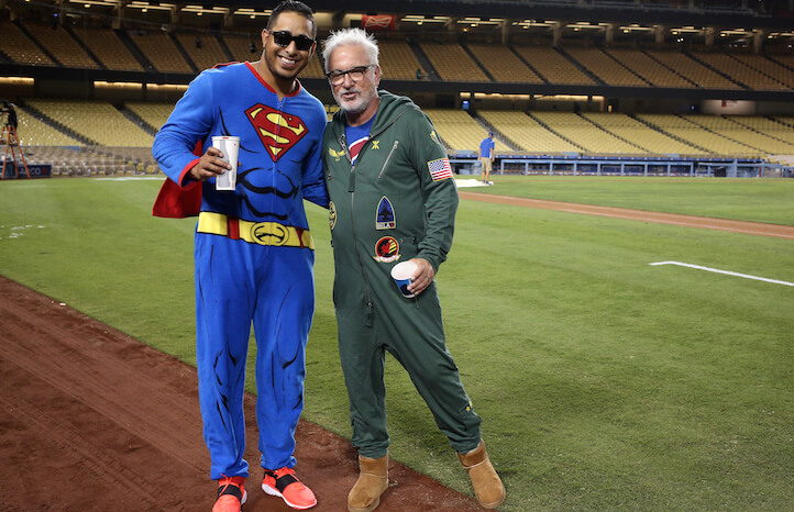 LOS ANGELES, CA - AUGUST 30: Manager Joe Maddon (R) and pitcher Hector Rondon #56 of the Chicago Cubs pose for a photo as they wear pajamas as part of a team theme trip on their way out of town after the game against the Los Angeles Dodgers at Dodger Stadium on August 30, 2015 in Los Angeles, California. The Cubs won 2-0. (Photo by Stephen Dunn/Getty Images)